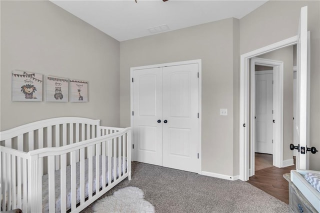 2409 SE Ridge Line Dr, Blue Springs, MO 64014 - bedroom with a closet, baseboards, carpet flooring, and a crib