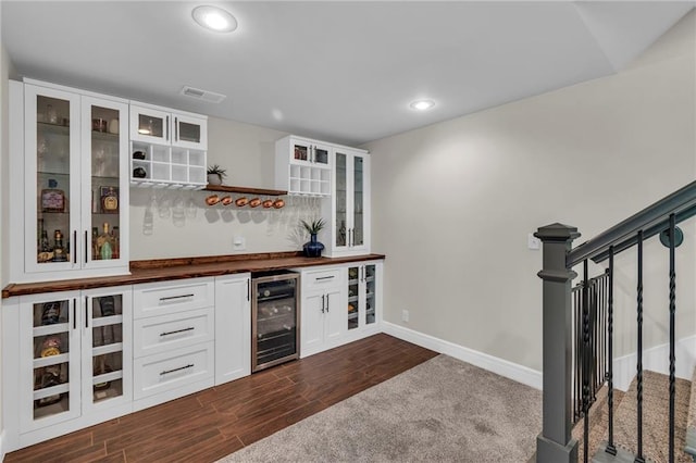2409 SE Ridge Line Dr, Blue Springs, MO 64014 - indoor dry bar featuring wine cooler, recessed lighting, baseboards, and dark wood-style flooring