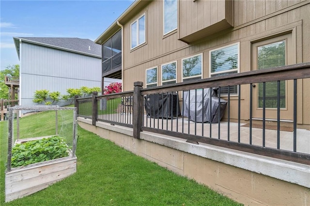 2409 SE Ridge Line Dr, Blue Springs, MO 64014 - back of property with a lawn and a vegetable garden