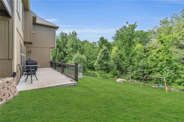 2409 SE Ridge Line Dr, Blue Springs, MO 64014 - view of grassy yard with a patio and a playground