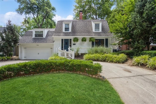 5516 Chadwick Rd, Fairway, KS 66205 - view of front of property with a shingled roof, a chimney, a garage, driveway, and a front lawn
