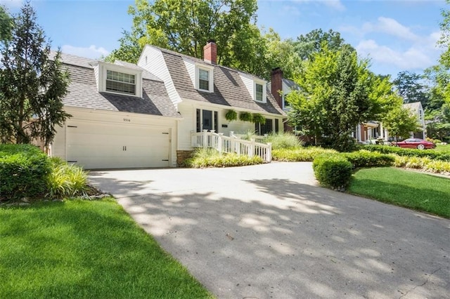 5516 Chadwick Rd, Fairway, KS 66205 - dutch colonial featuring a garage, a chimney, roof with shingles, driveway, and a front yard