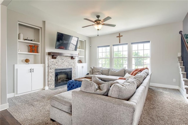 12435 Parkview Ave, Kansas City, KS 66109 - living area featuring stairway, ceiling fan, a fireplace, baseboards, and built in features