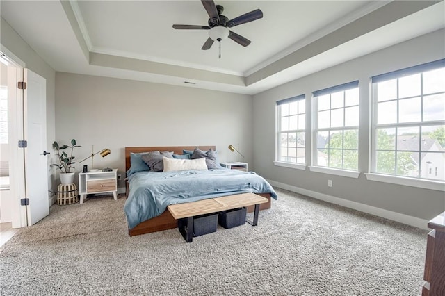 12435 Parkview Ave, Kansas City, KS 66109 - carpeted bedroom featuring a tray ceiling, crown molding, baseboards, and ceiling fan