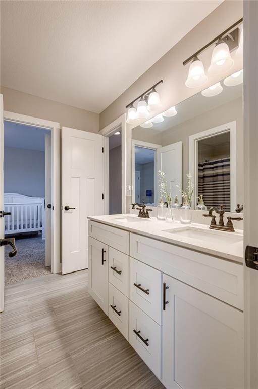 12435 Parkview Ave, Kansas City, KS 66109 - full bathroom with double vanity and ensuite bathroom