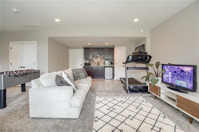 12435 Parkview Ave, Kansas City, KS 66109 - living area featuring bar, recessed lighting, and light carpet