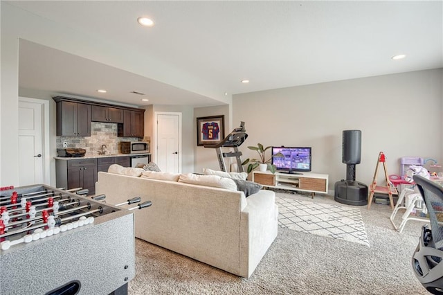 12435 Parkview Ave, Kansas City, KS 66109 - living room featuring light carpet, recessed lighting, and bar