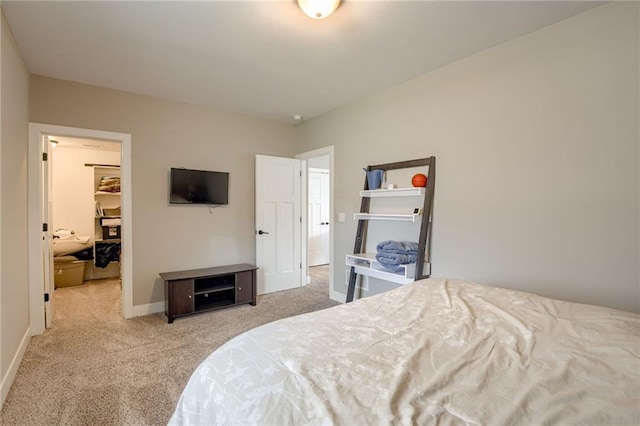 12435 Parkview Ave, Kansas City, KS 66109 - bedroom featuring carpet, a walk in closet, baseboards, and a closet