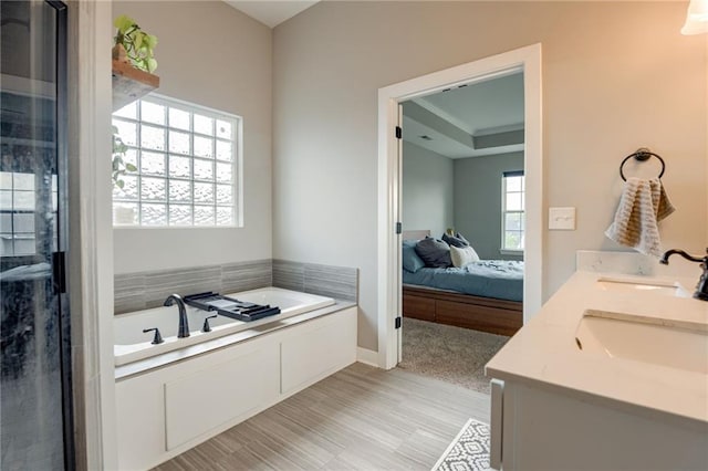 12435 Parkview Ave, Kansas City, KS 66109 - bathroom with a bath, double vanity, an enclosed shower, and wood finished floors