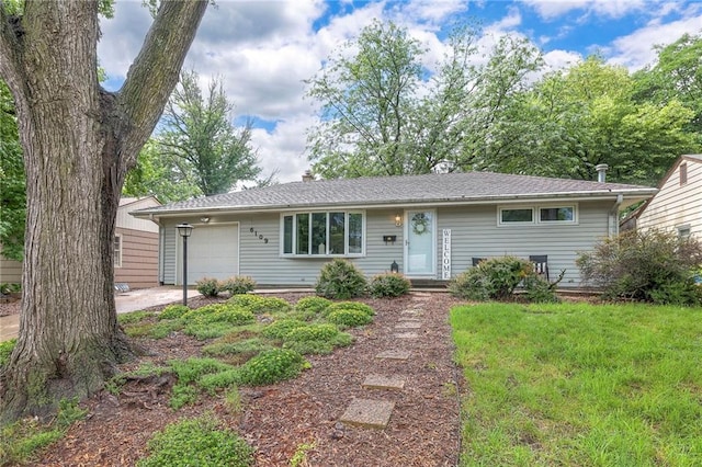 6109 W 54th Ter, Mission, KS 66202 - ranch-style home featuring a garage and a front lawn