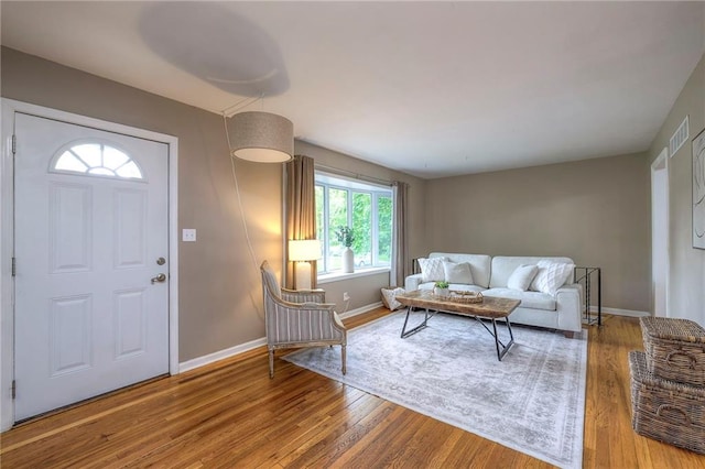 6109 W 54th Ter, Mission, KS 66202 - living area featuring wood finished floors and baseboards
