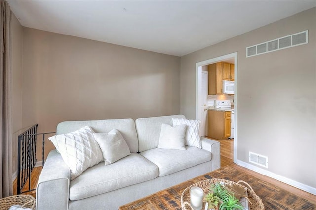 6109 W 54th Ter, Mission, KS 66202 - living area featuring light wood finished floors and baseboards