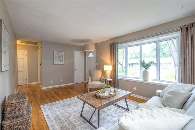 6109 W 54th Ter, Mission, KS 66202 - living room featuring baseboards and light wood-style floors