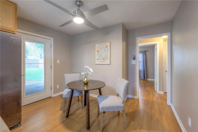 6109 W 54th Ter, Mission, KS 66202 - dining area featuring light wood finished floors, baseboards, and ceiling fan