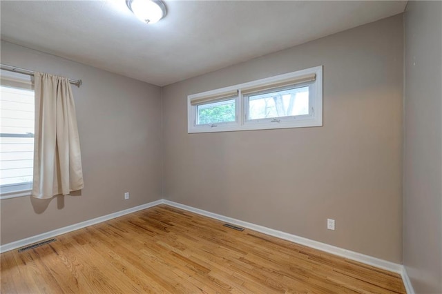 6109 W 54th Ter, Mission, KS 66202 - empty room with baseboards and light wood finished floors