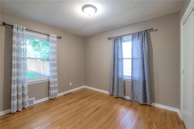 6109 W 54th Ter, Mission, KS 66202 - unfurnished room with light wood-style floors and baseboards