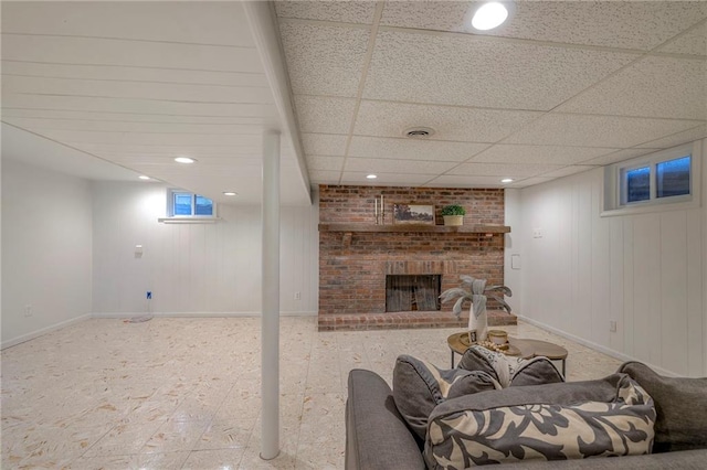 6109 W 54th Ter, Mission, KS 66202 - basement featuring baseboards, a brick fireplace, recessed lighting, and a paneled ceiling