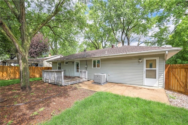 6109 W 54th Ter, Mission, KS 66202 - back of house with cooling unit, a deck, a chimney, and a patio