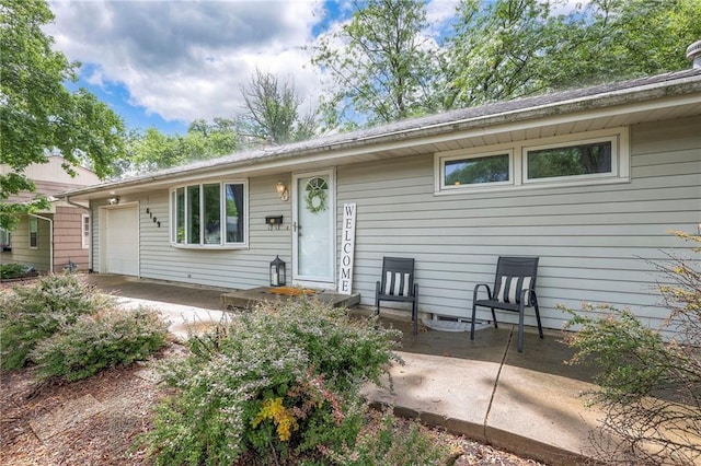 6109 W 54th Ter, Mission, KS 66202 - view of front of house featuring a garage