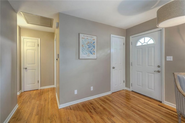 6109 W 54th Ter, Mission, KS 66202 - foyer with light wood-style floors and baseboards