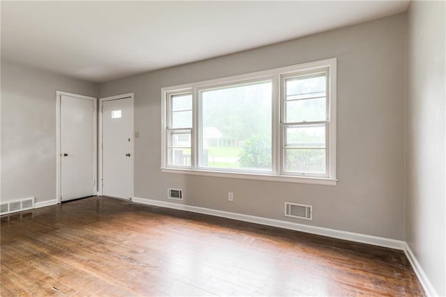 6721 Larsen Ln, Shawnee, KS 66203 - entryway featuring healthy amount of natural light, wood finished floors, and baseboards