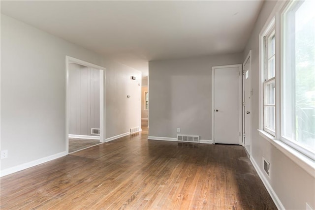 6721 Larsen Ln, Shawnee, KS 66203 - unfurnished room featuring hardwood / wood-style floors and baseboards