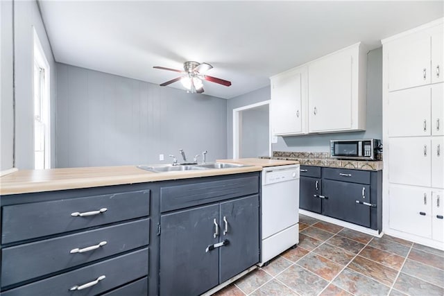 6721 Larsen Ln, Shawnee, KS 66203 - kitchen featuring a sink, dishwasher, stainless steel microwave, white cabinetry, and a ceiling fan