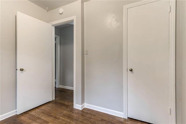 6721 Larsen Ln, Shawnee, KS 66203 - unfurnished bedroom featuring dark wood-style floors and baseboards