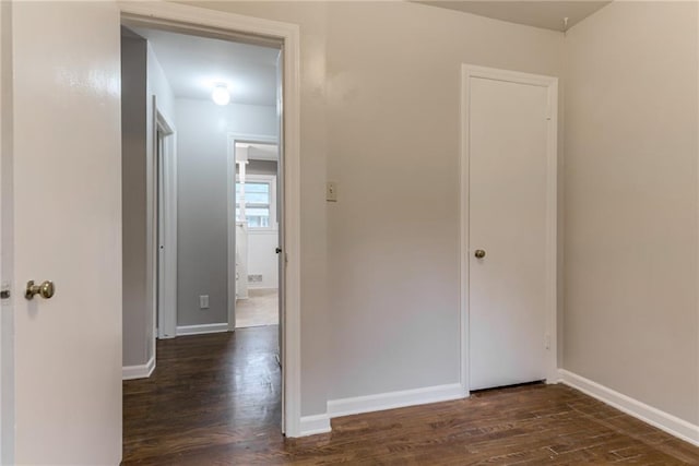 6721 Larsen Ln, Shawnee, KS 66203 - hallway featuring dark wood-type flooring and baseboards