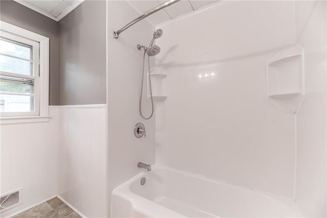 6721 Larsen Ln, Shawnee, KS 66203 - bathroom featuring a wainscoted wall and bathing tub / shower combination