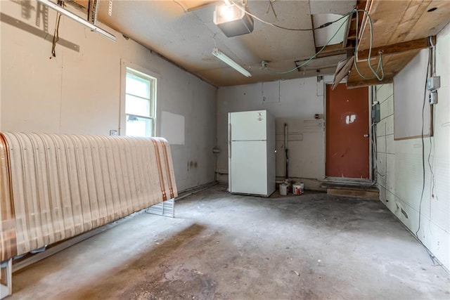6721 Larsen Ln, Shawnee, KS 66203 - garage with freestanding refrigerator and a garage door opener