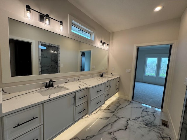 9019 Freedom Cir, Lenexa, KS 66227 - full bathroom with baseboards, double vanity, recessed lighting, a shower, and marble look tiles
