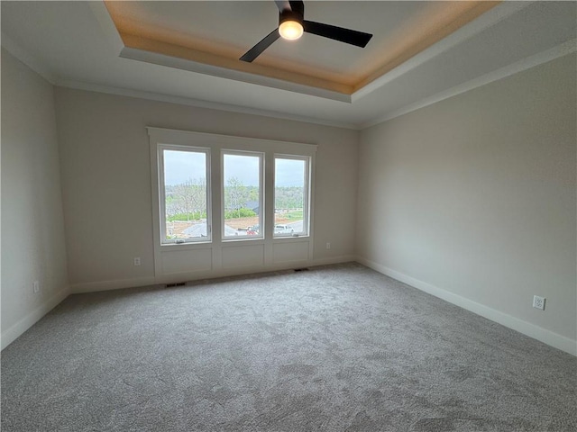 9019 Freedom Cir, Lenexa, KS 66227 - carpeted empty room featuring a tray ceiling, ceiling fan, baseboards, and crown molding
