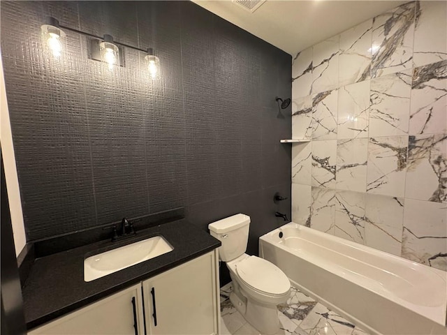 9019 Freedom Cir, Lenexa, KS 66227 - full bath with tile walls, marble look tile flooring, shower / bath combination, toilet, and vanity