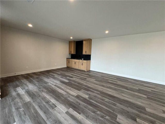 9019 Freedom Cir, Lenexa, KS 66227 - unfurnished living room featuring baseboards, recessed lighting, and dark wood-style flooring