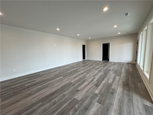 9019 Freedom Cir, Lenexa, KS 66227 - empty room with dark wood-style flooring, recessed lighting, and baseboards