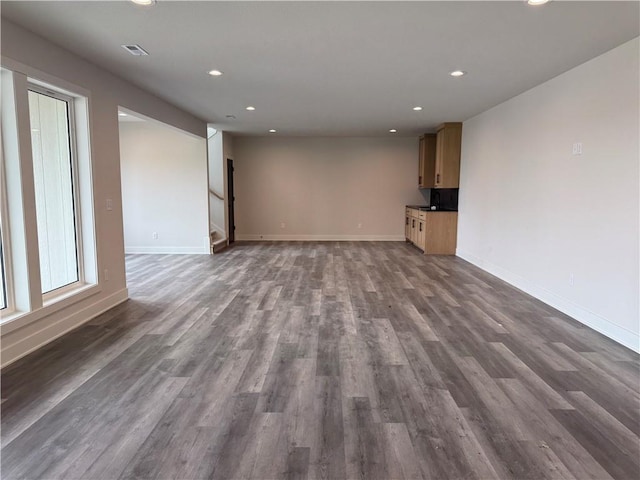 9019 Freedom Cir, Lenexa, KS 66227 - unfurnished living room with recessed lighting, baseboards, and dark wood-style flooring
