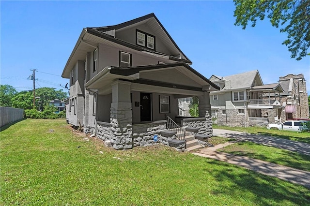 3218 Benton Blvd, Kansas City, MO 64128 - traditional style home with stone siding, a porch, and stucco siding