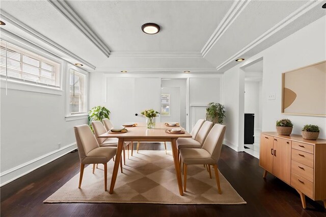 3218 Benton Blvd, Kansas City, MO 64128 - dining area with a tray ceiling, dark wood finished floors, ornamental molding, baseboards, and recessed lighting