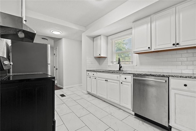 3218 Benton Blvd, Kansas City, MO 64128 - kitchen with stainless steel appliances, a sink, range hood, light marble finish floors, and dark stone countertops