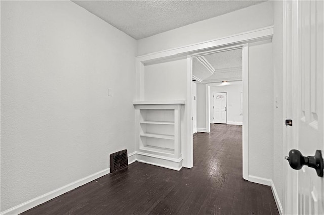 3218 Benton Blvd, Kansas City, MO 64128 - hall featuring a textured ceiling, wood finished floors, and baseboards