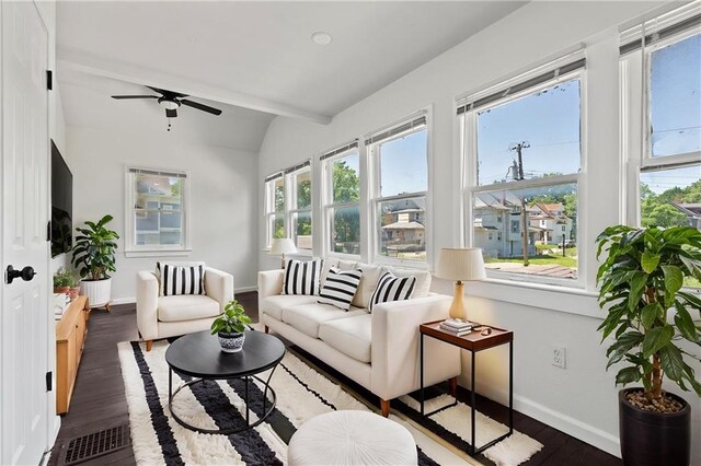 3218 Benton Blvd, Kansas City, MO 64128 - living area with vaulted ceiling, wood finished floors, plenty of natural light, a ceiling fan, and baseboards
