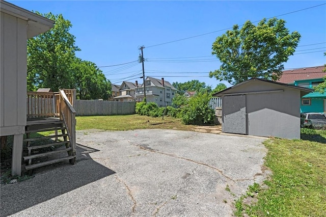 3218 Benton Blvd, Kansas City, MO 64128 - view of patio featuring a deck