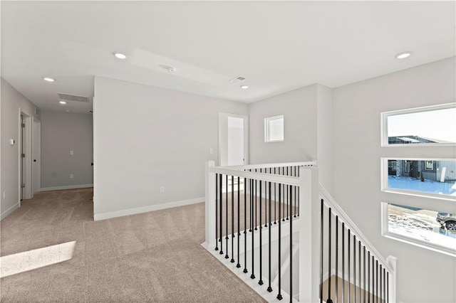 338 Meadowlark Dr, Raymore, MO 64083 - hall with an upstairs landing, carpet, recessed lighting, and baseboards