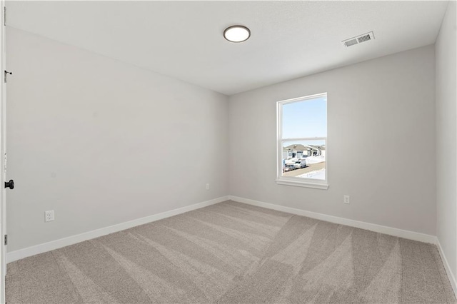 338 Meadowlark Dr, Raymore, MO 64083 - empty room featuring light carpet and baseboards