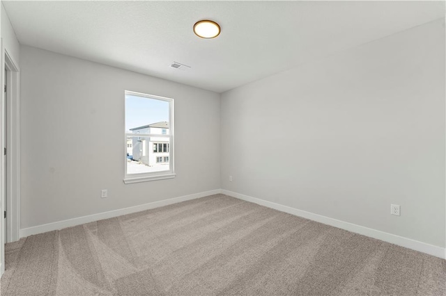 338 Meadowlark Dr, Raymore, MO 64083 - carpeted empty room with baseboards