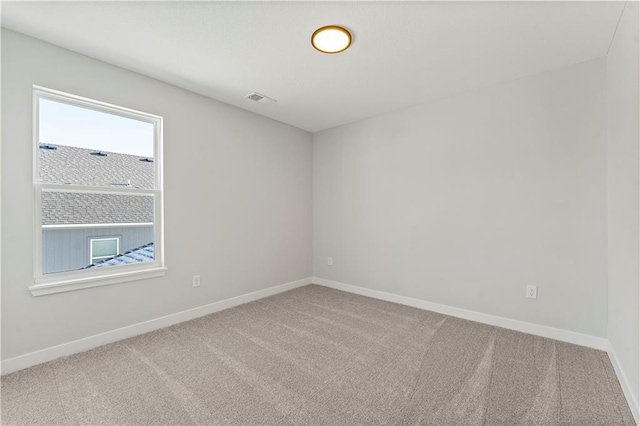 338 Meadowlark Dr, Raymore, MO 64083 - unfurnished room featuring healthy amount of natural light, carpet flooring, and baseboards