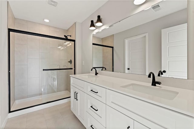 338 Meadowlark Dr, Raymore, MO 64083 - full bath featuring a shower stall, tile patterned flooring, and double vanity