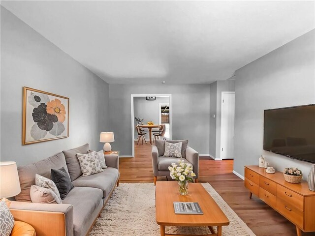 11709 Fremont Ave, Kansas City, MO 64134 - living room featuring light wood-type flooring and baseboards