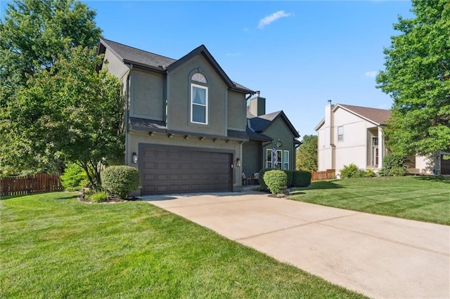 21607 W 51st St, Shawnee, KS 66226 - view of front facade featuring an attached garage, concrete driveway, and stucco siding